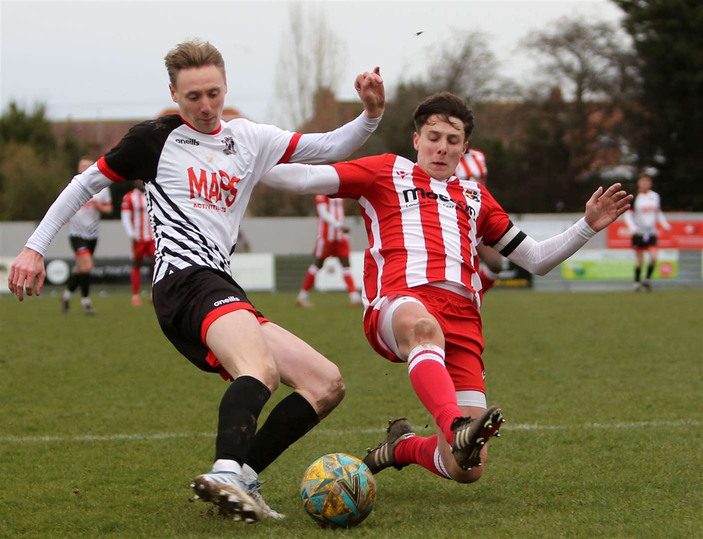 Deal's Ben Chapman fires in a cross ahead of James White of Rusthall. Picture: Paul Willmott