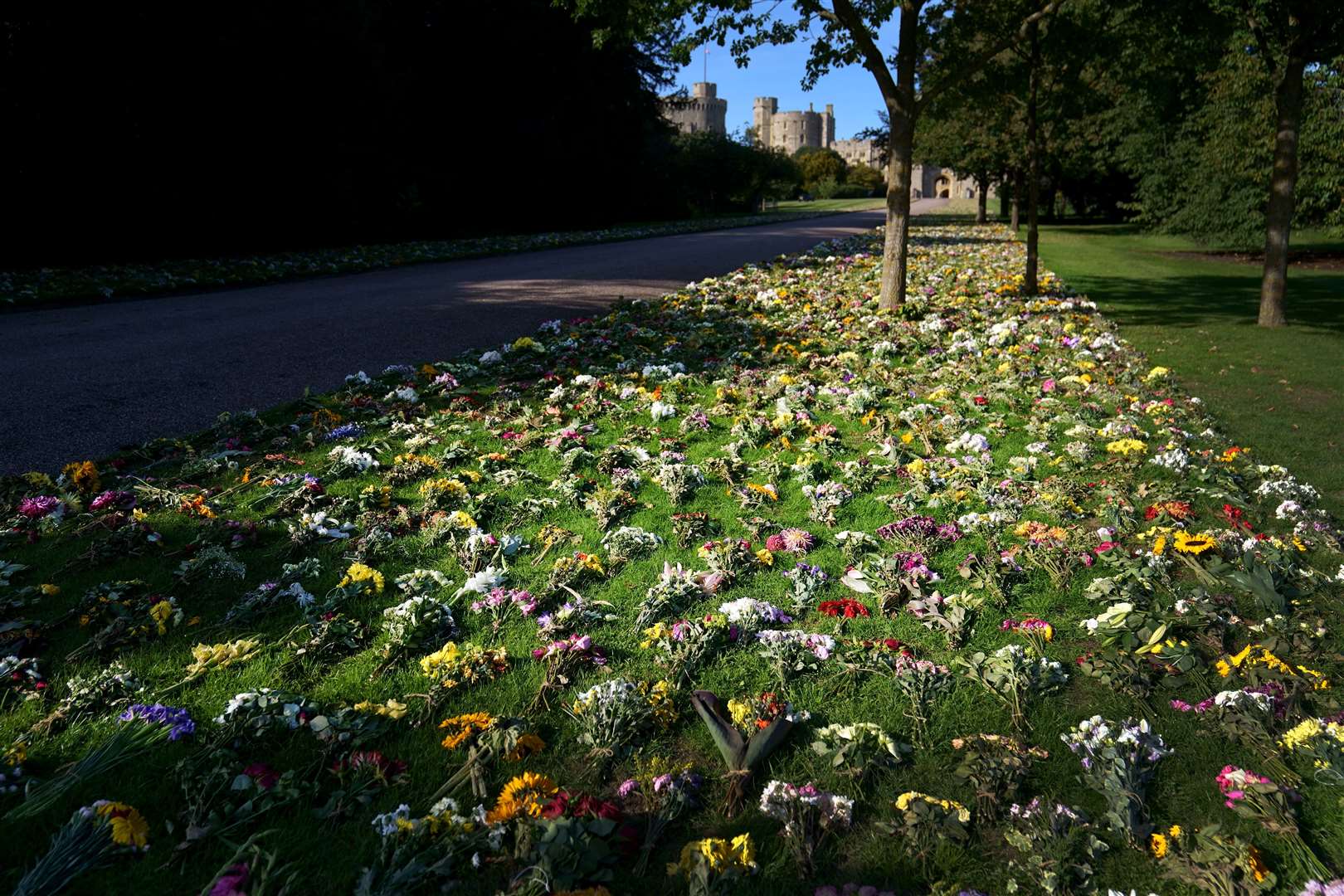 Floral tributes from members of the public are laid outside Windsor Castle onto Cambridge Drive, near the Long Walk, Windsor (Victoria Jones/PA)