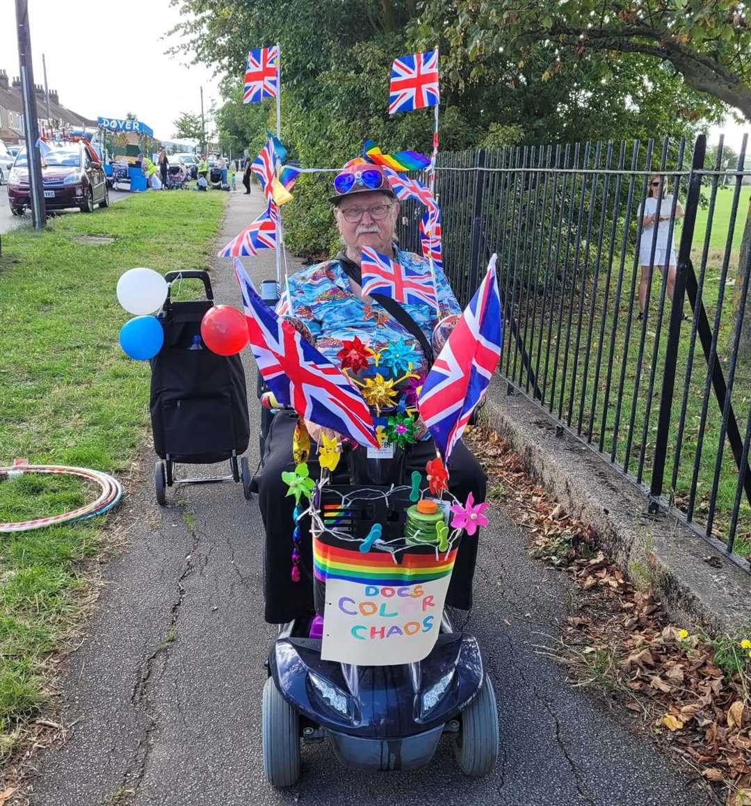 Brian Terry on his mobility scooter decorated in flags and bright colours. Picture: David Terry