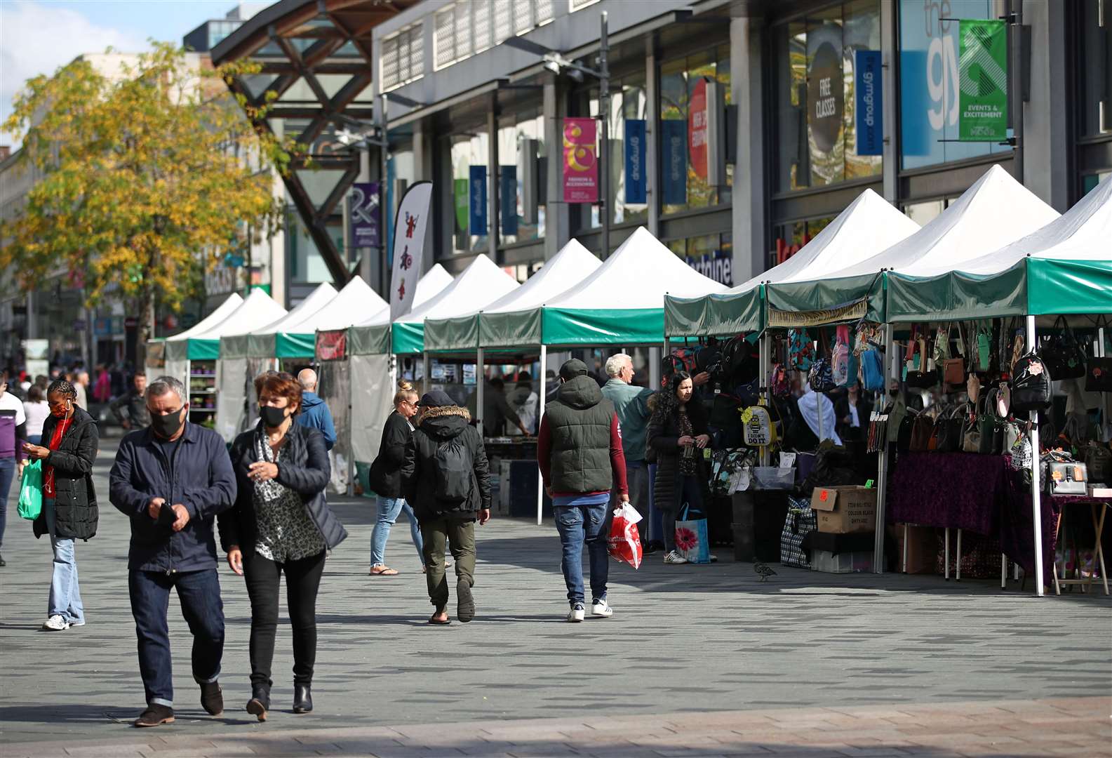 Market stalls remain open at the Moor Open Market in Sheffield, South Yorkshire, but face coverings are a common sight (Tim Goode/PA)