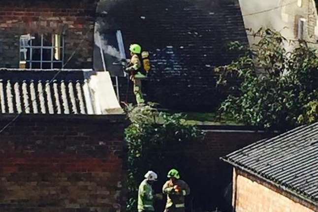 Firefighters at the scene, in Brewer Street