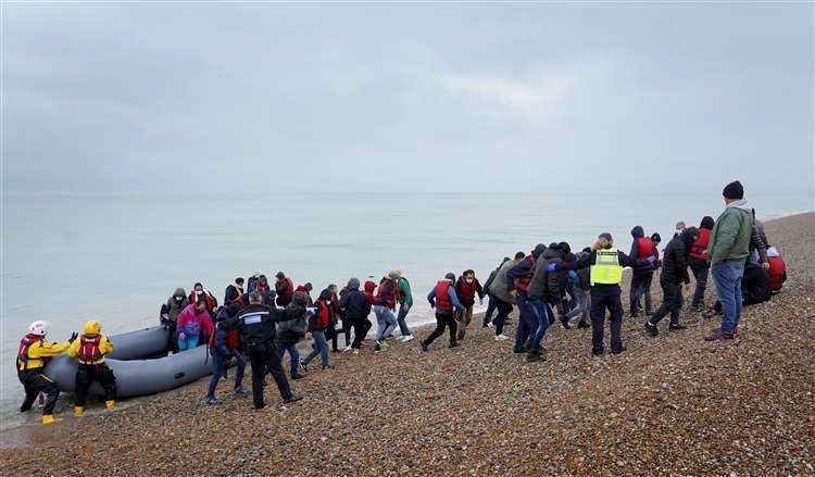 A group of people thought to be asylum seekers are brought in to Dungeness, by the RNLI. Picture: Gareth Fuller/PA