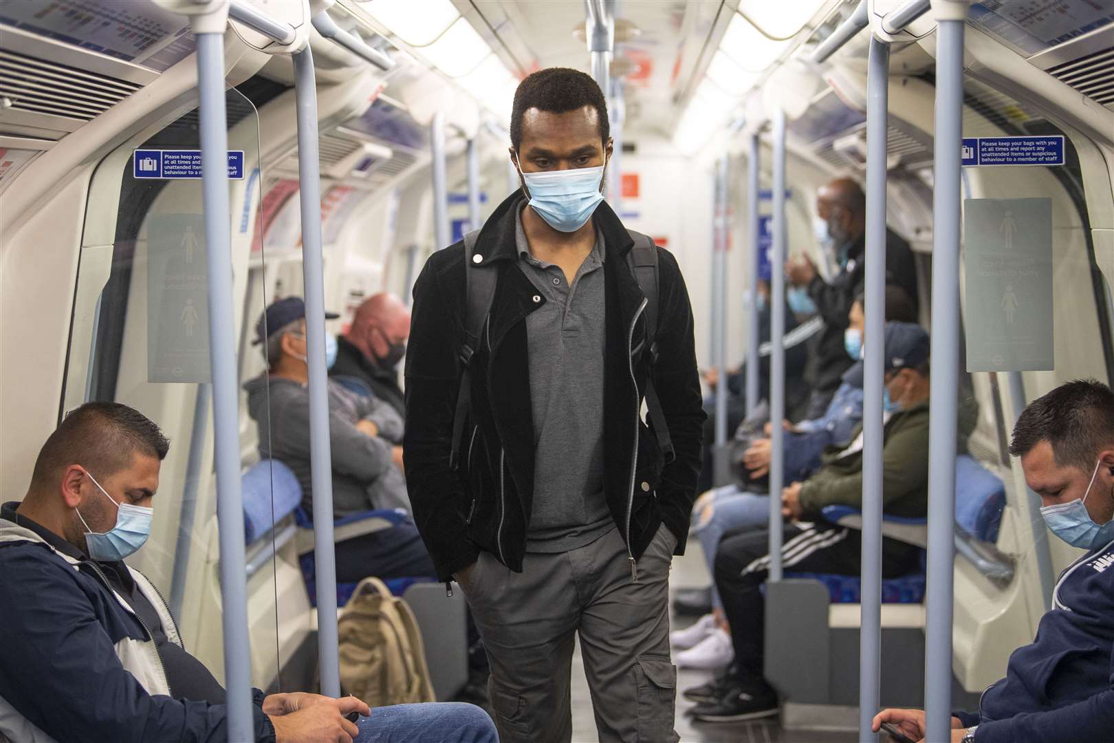 Passengers wearing face masks on the Jubilee Line in east London (Victoria Jones/PA)