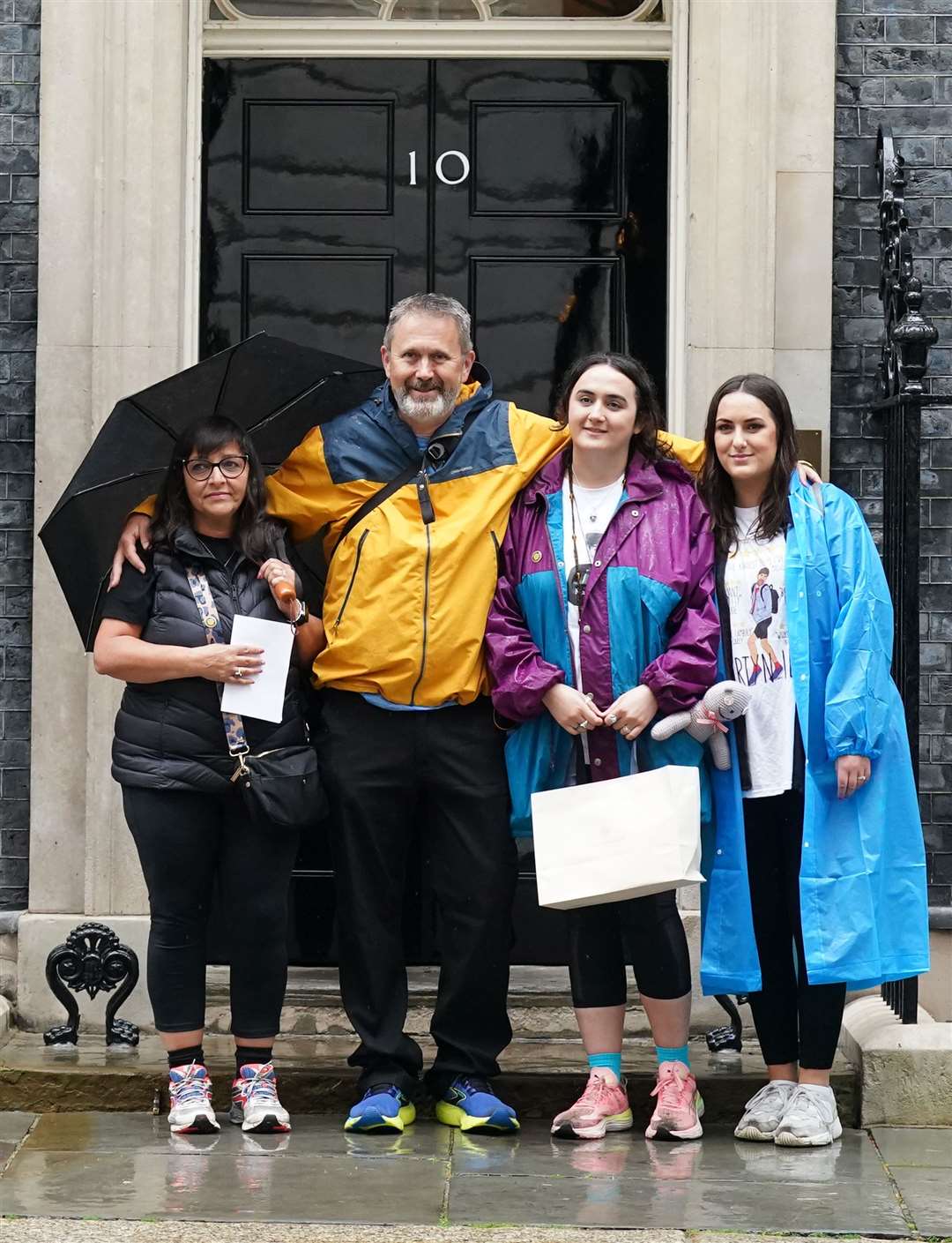 Figen Murray in Downing Street with husband Stuart Murray and daughters Nikita Murray and Louise Webster (Stefan Rousseau/PA)