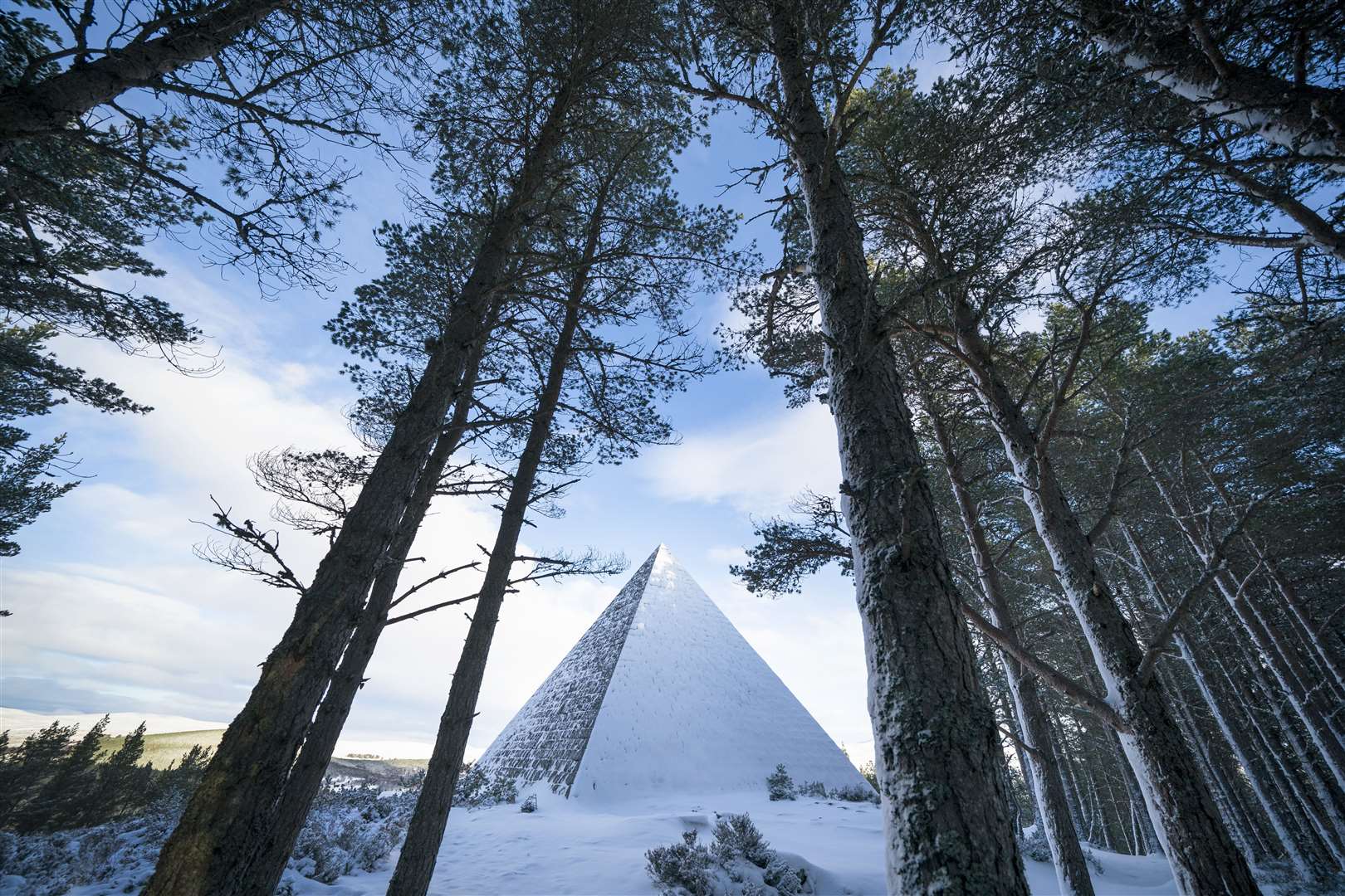 The Prince Albert Cairn, built in 1862 by Queen Victoria, rises out of the snow (Jane Barlow/PA)