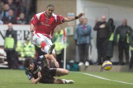 TOUGH COMPETITOR: Thomas riding a challenge from Joey Barton in a match against Machester City. Picture: MATT WALKER.