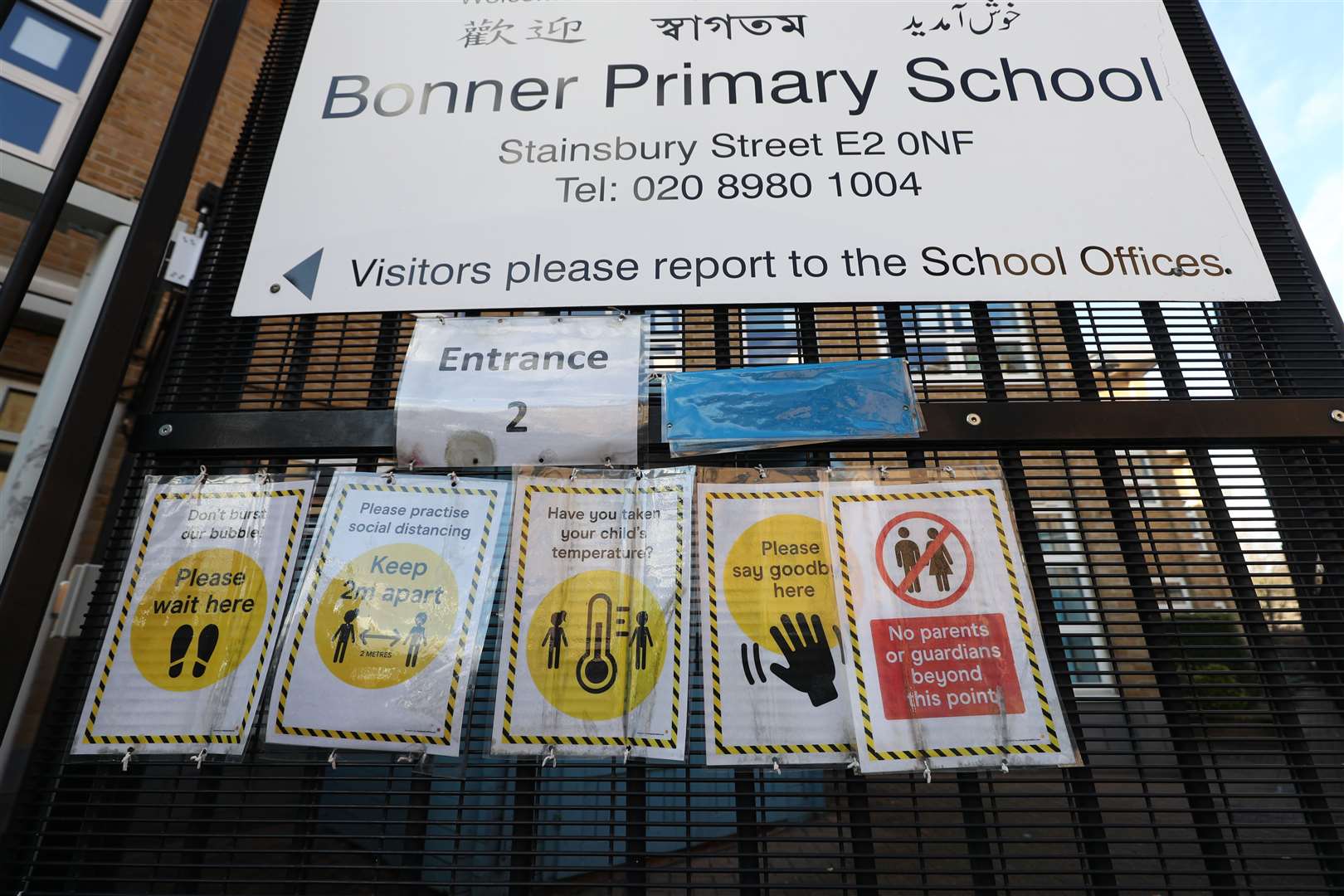 Signs outside Bonner Primary School in Tower Hamlets, east London, give advice about necessary precautions to prevent the spread of coronavirus (Yui Mok/PA)