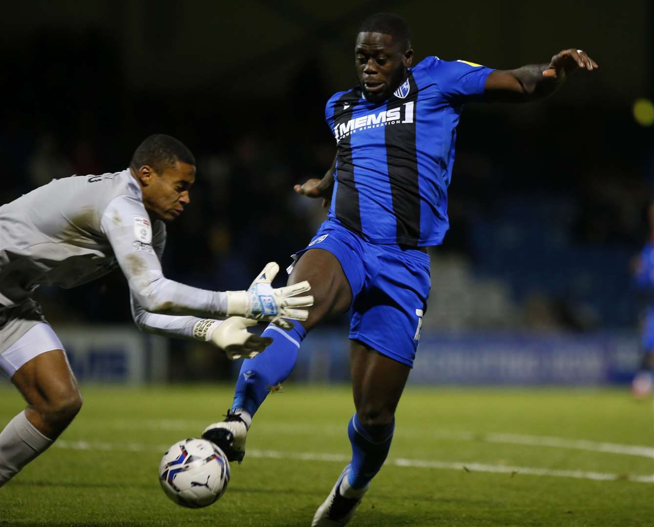 Gills striker John Akinde tests Portsmouth goalkeeper Gavin Bazunu. Picture: Andy Jones