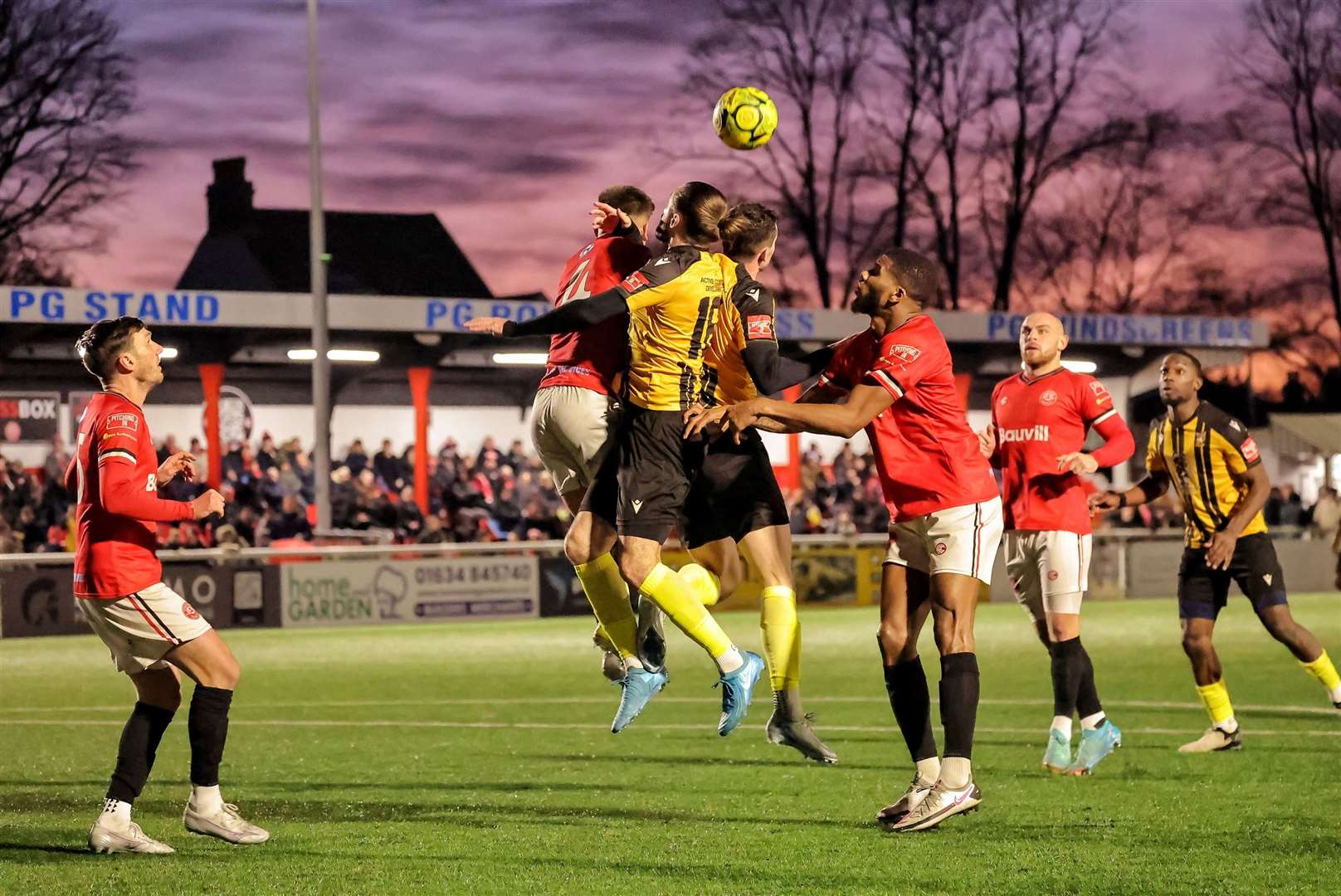 Folkestone substitute Tom Derry contests a header in the Chatham box. Picture: Helen Cooper