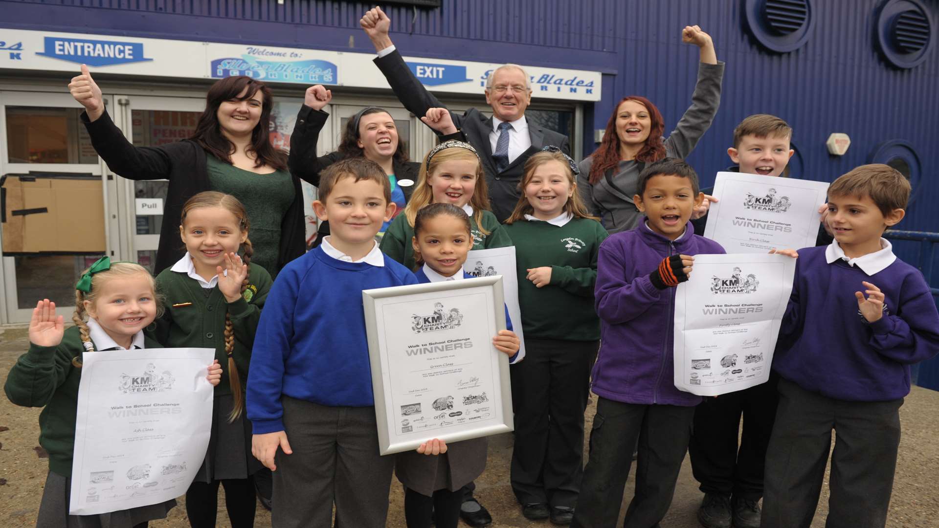 Walk to School Challenge Day winners at Silver Blades ice rink with adults Catherine Underdown, Mike O'Brien, Amy Woods and Laura Farragher.