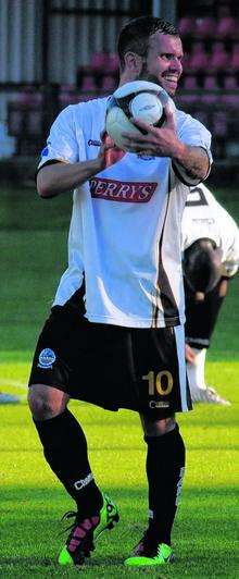 Hat-trick hero Adam Birchall shows off the match-ball to Whites fans