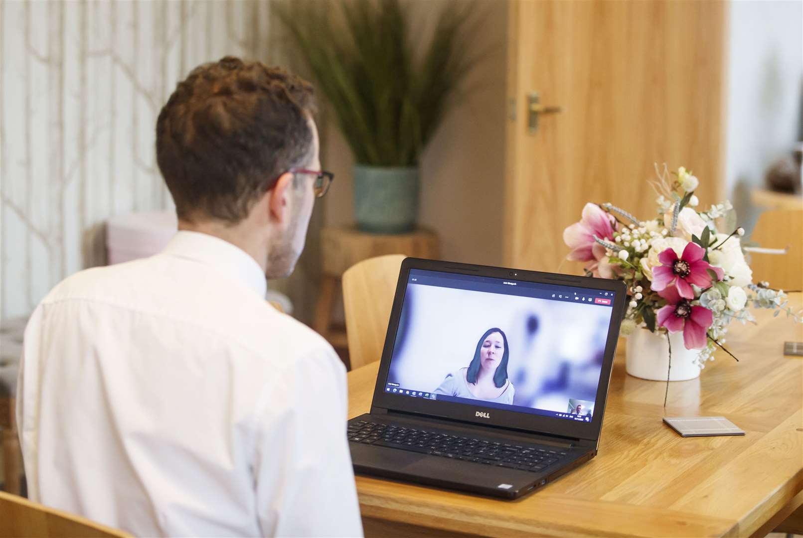 Funeral director Andrew Atkins talks to a colleague online at Full Circle Funerals (Danny Lawson/PA)