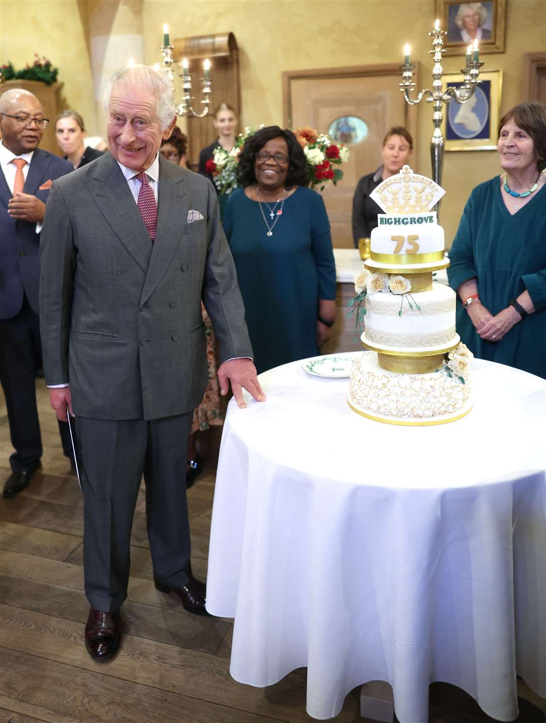 The King next to a birthday cake during his 75th birthday party at Highgrove Gardens in Tetbury on the eve of his birthday last year (Chris Jackson/PA)