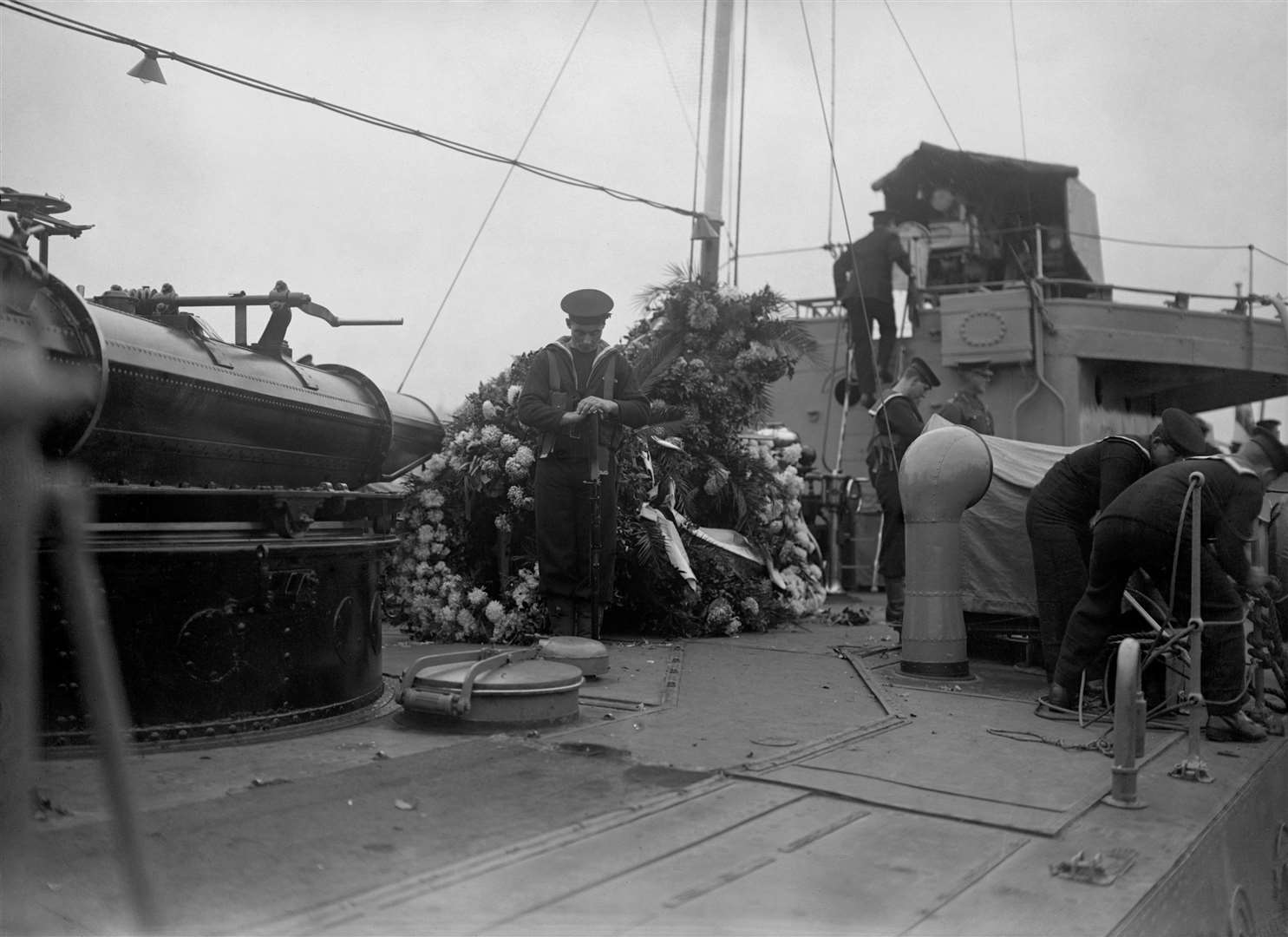 Royal Navy Bluejackets guard the coffin aboard HMS Verdun as it sailed from France (PA)