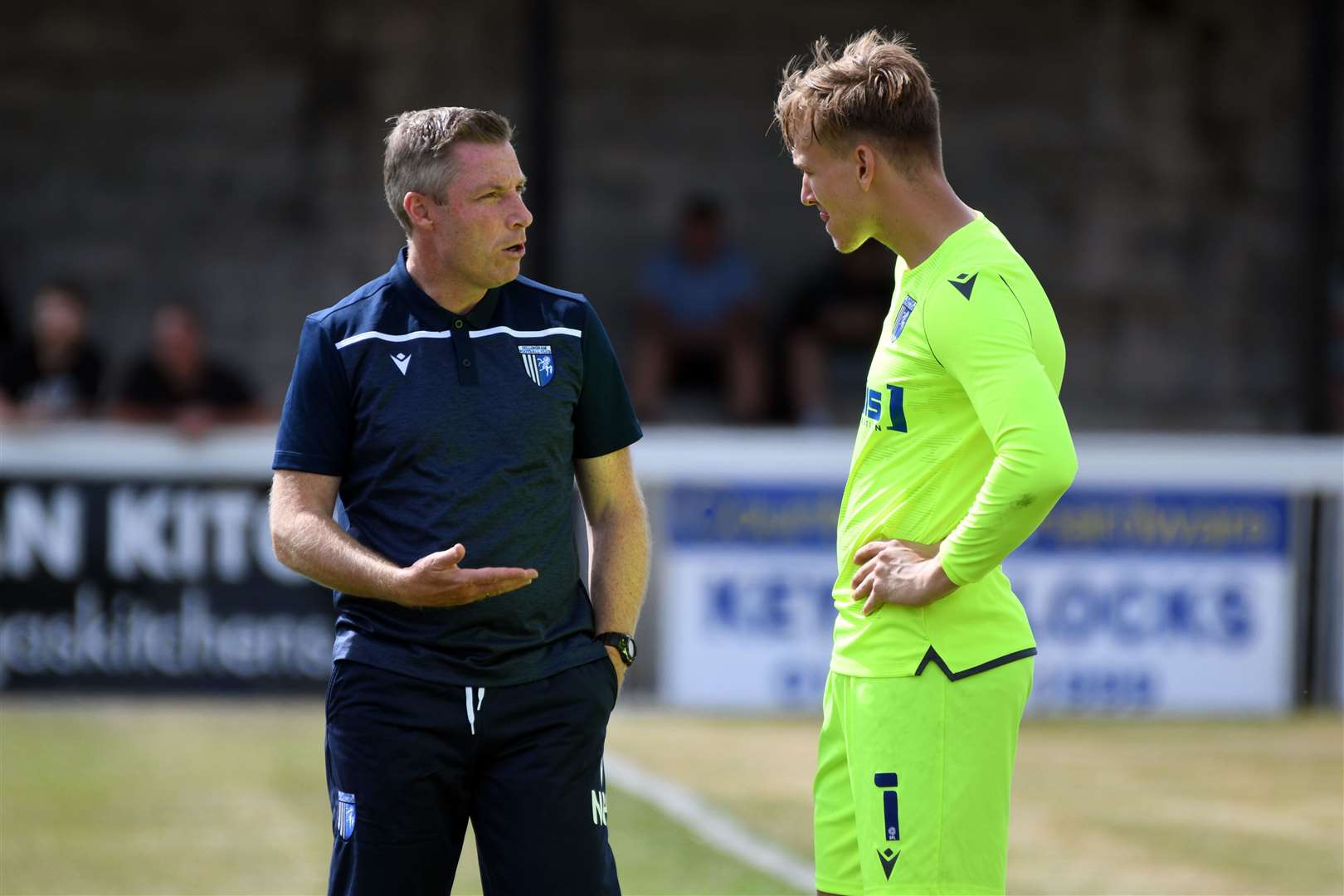 Gillingham manager Neil Harris chatting with goalkeeper Ashley Maynard-Brewer Picture: Barry Goodwin