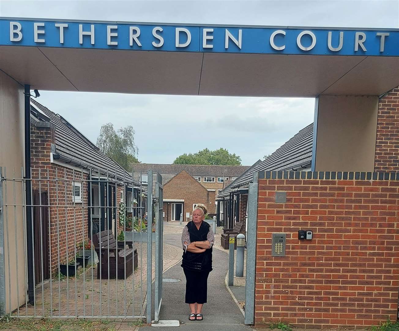 Linda at the entrance of Bethersden Court