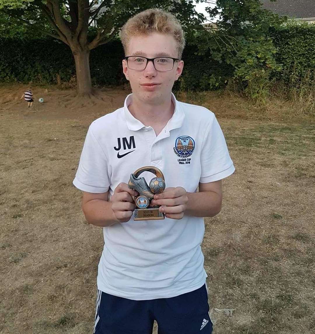 Joe Markiewicz with one of his many footballing trophies