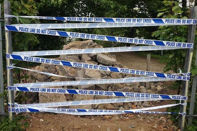 Police tape blocks the entrance to Brooklands Lake back in May
