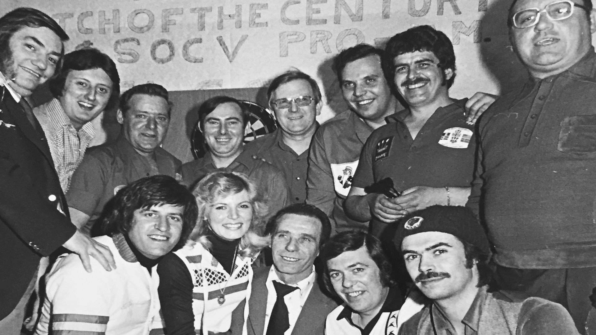 Eric Bristow (second from left) with his dad George to his left and other famous faces. George Ball is fourth from the right (standing).