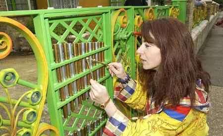 HIGH NOTE: Evelyn Glennie taps out a tune on the musical fence. Picture: GERRY WHITTAKER