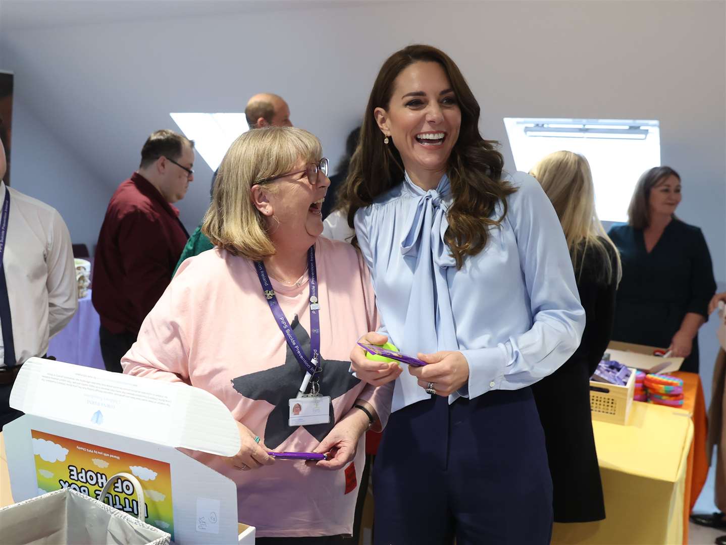 The Princess of Wales speaks to a volunteer during a visit to the PIPS charity in north Belfast (Liam McBurney/PA)