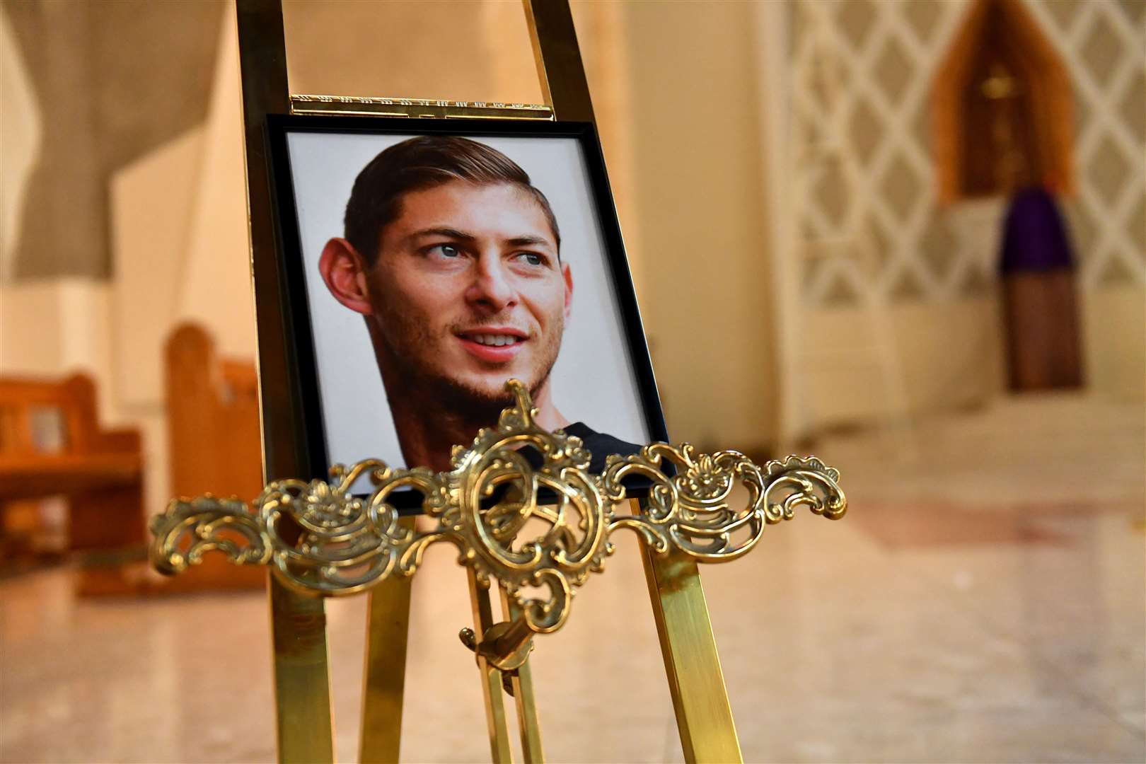 A portrait of Emiliano Sala is displayed at St David’s Cathedral, Cardiff (Jacob King/PA)