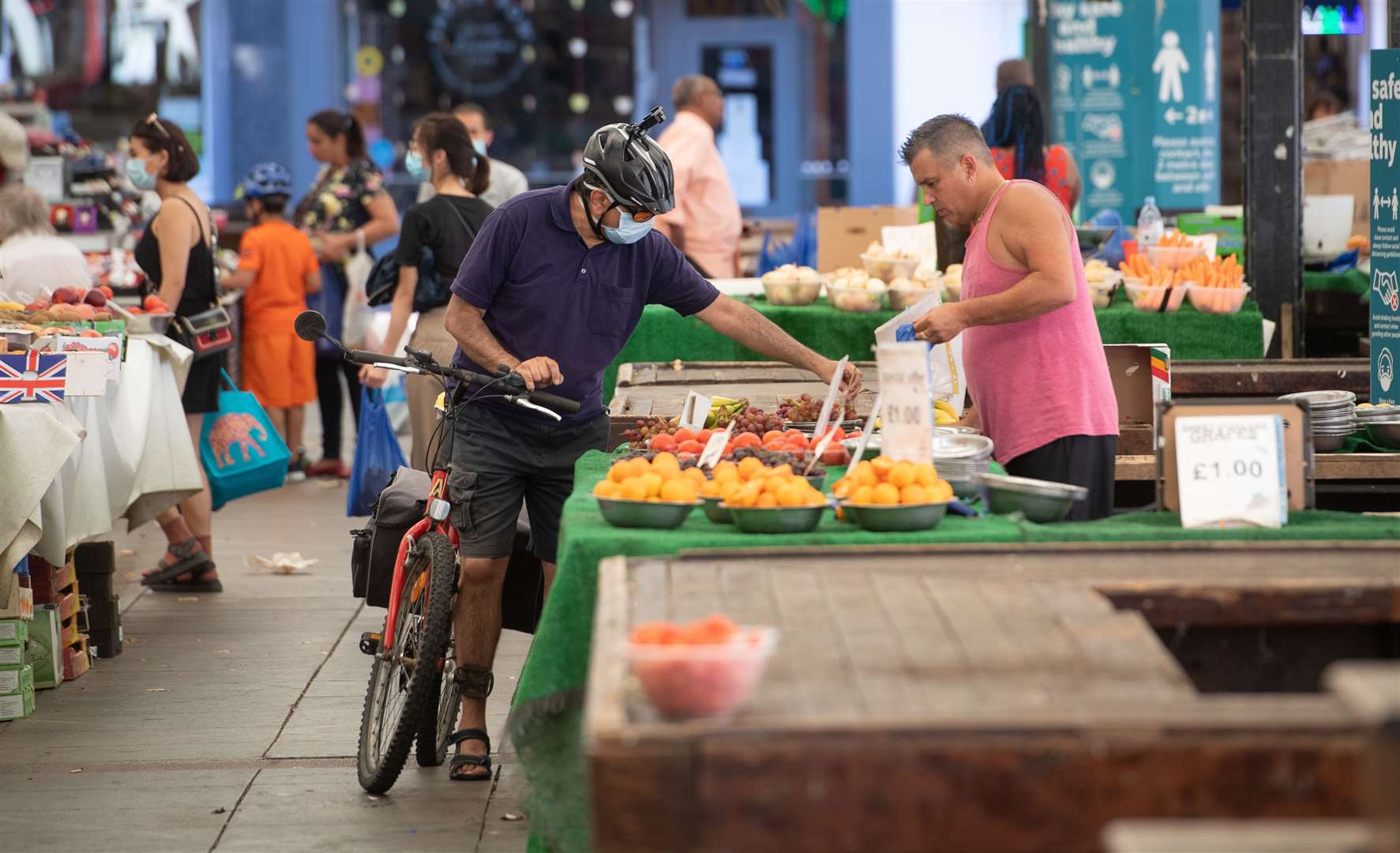 People shop at Leicester Market as a decision is due to be made on whether to lift the lockdown restrictions in the city (Joe Giddens/PA)