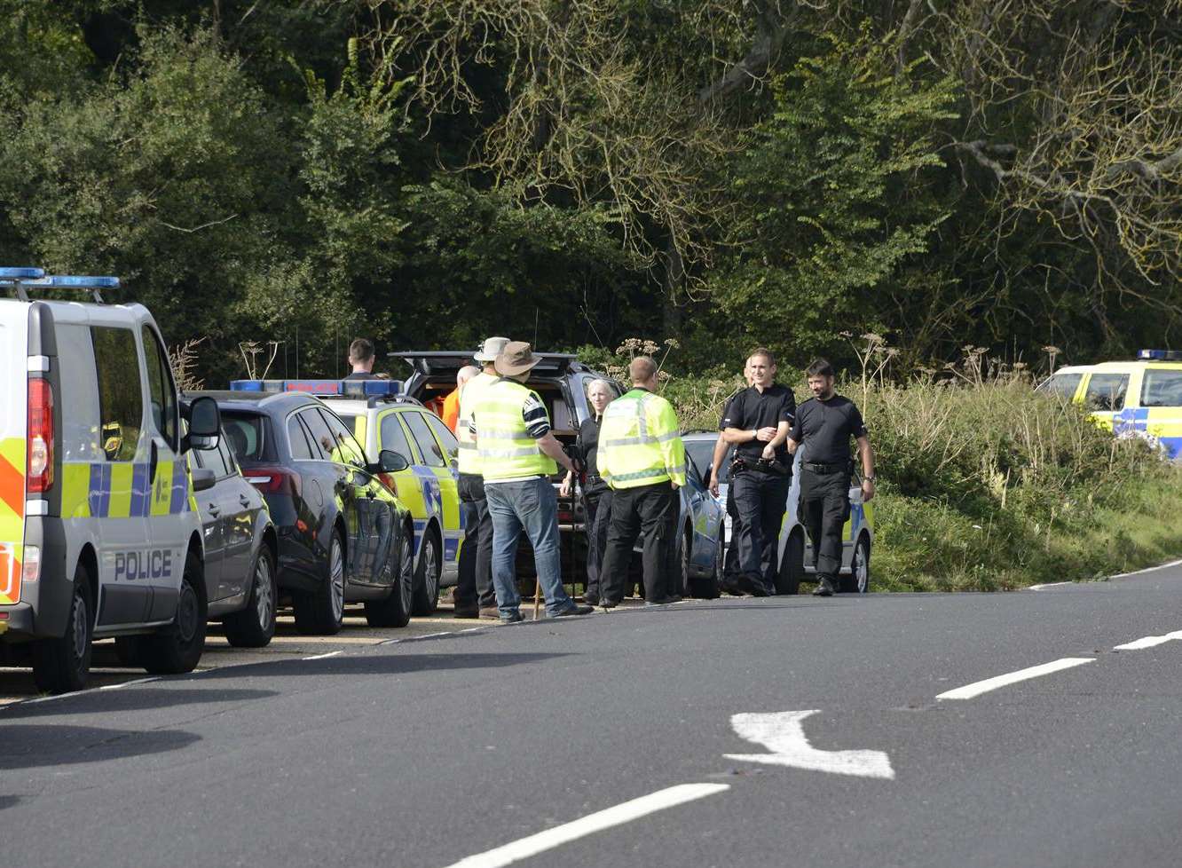 Police searching fields and woods off the A20 near Sandling. Pictures: Paul Amos