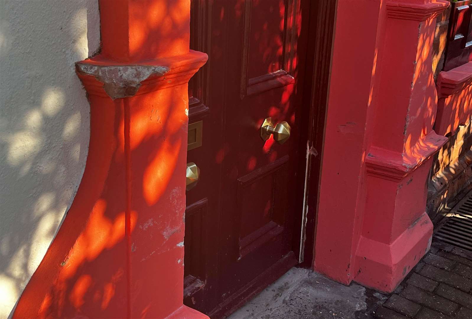 The house in High Street, Greenhithe, was left with damage to the door frame and brick work