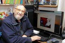 Harold Chapman checking out his advent calendar on screen