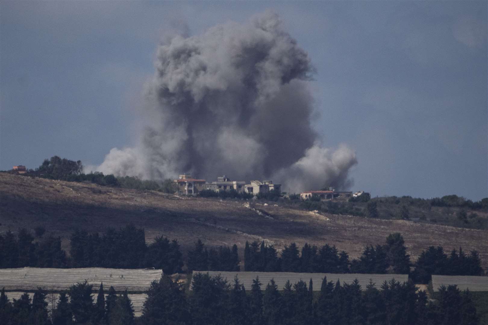 An Israeli air strike hits an area in southern Lebanon as seen from northern Israel (Leo Correa/AP)