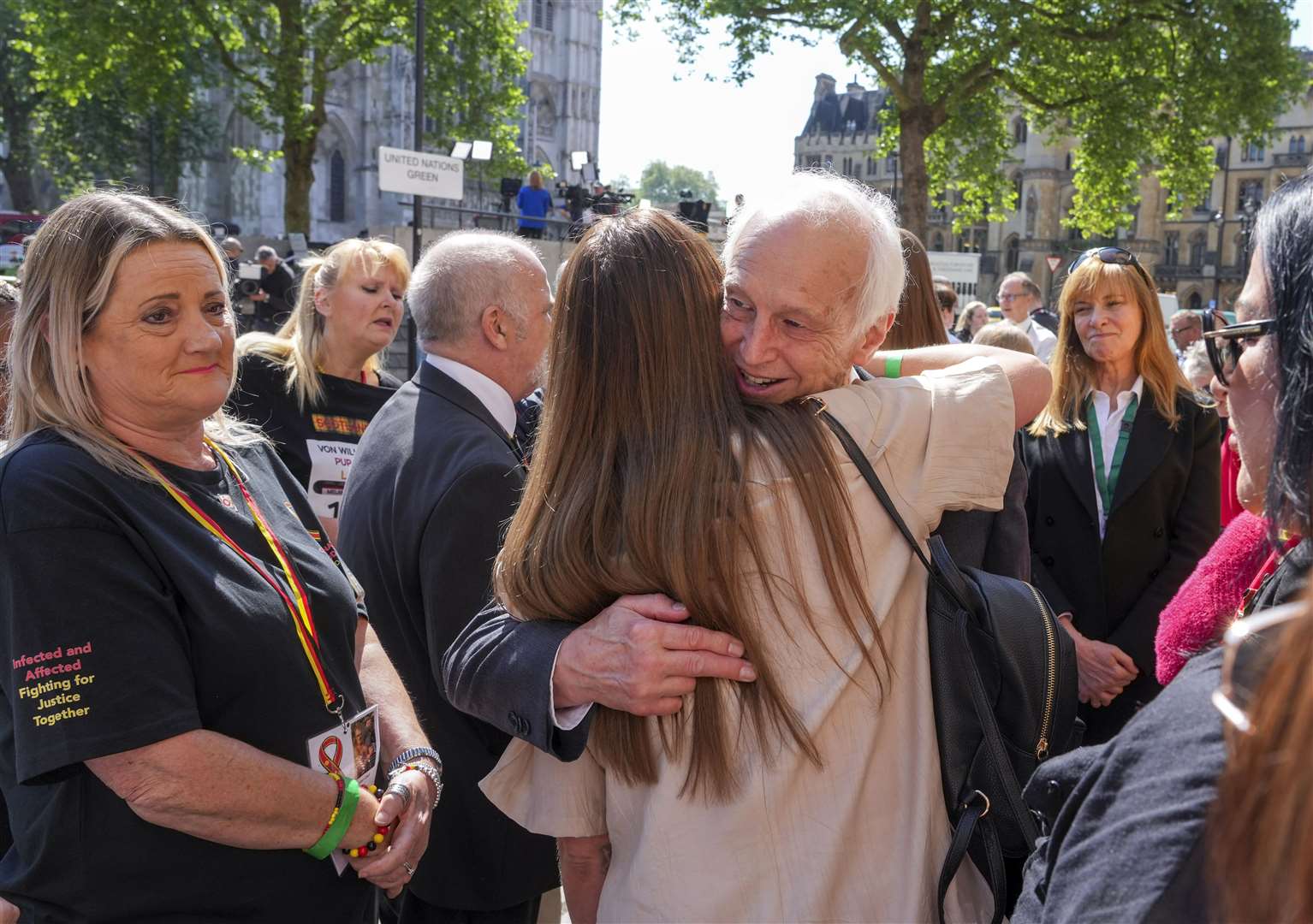 Chairman of the infected blood inquiry Sir Brian Langstaff with victims and campaigners (Jeff Moore/PA)