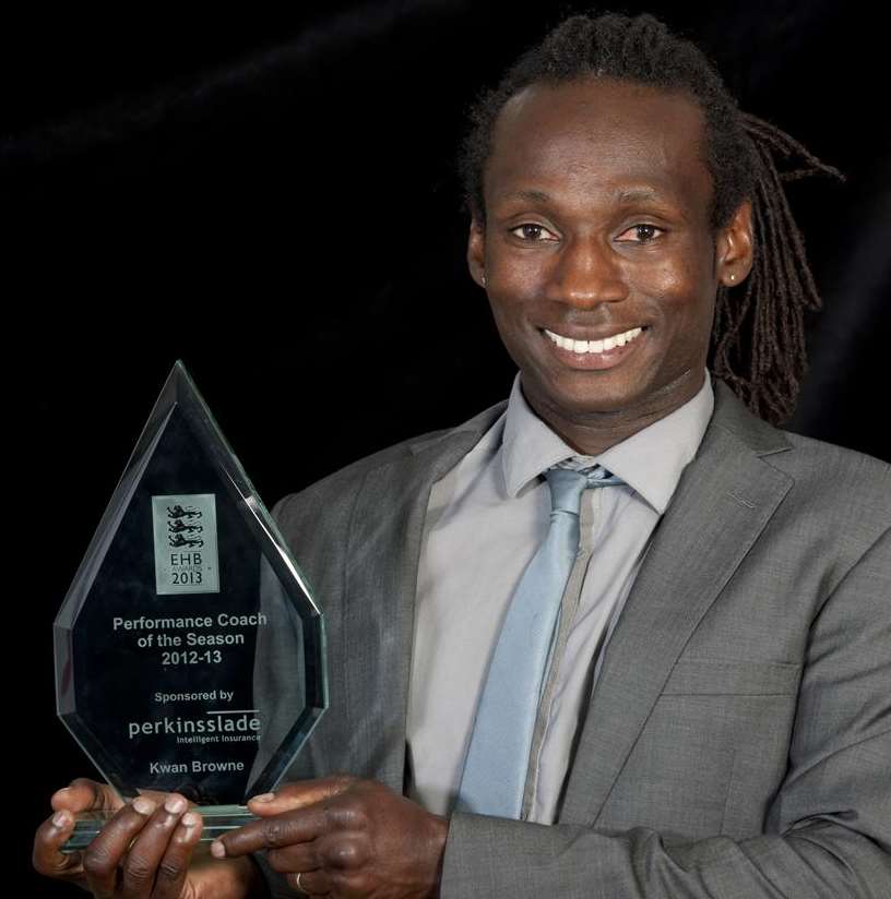 Canterbury's Kwan Browne with his trophy after being named Perkins Slade Performance Coach of the Season Picture: Ady Kerry/England Hockey