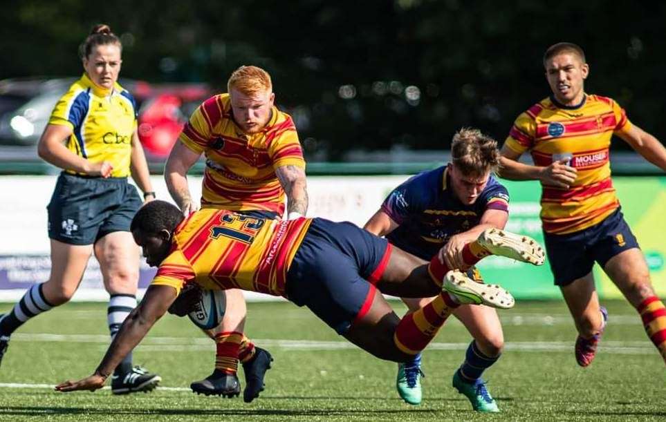 Medway's John Sipawa (No.13) in the heart of the action against Cobham. Picture: Jake Miles