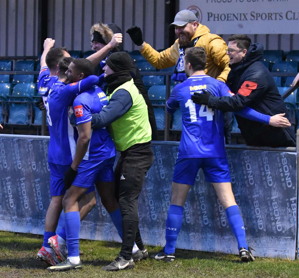 A familiar sight as Herne Bay players and fans celebrate a Michael Salako goal. Picture: Alan Coomes