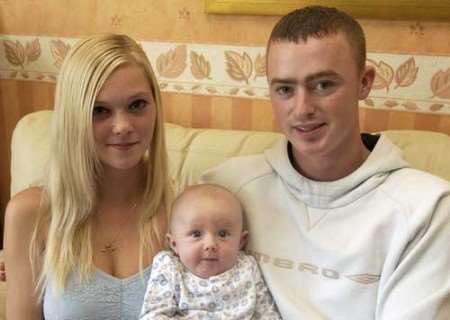 Reece Price with parents Michelle and Damian. Picture: TERRY SCOTT