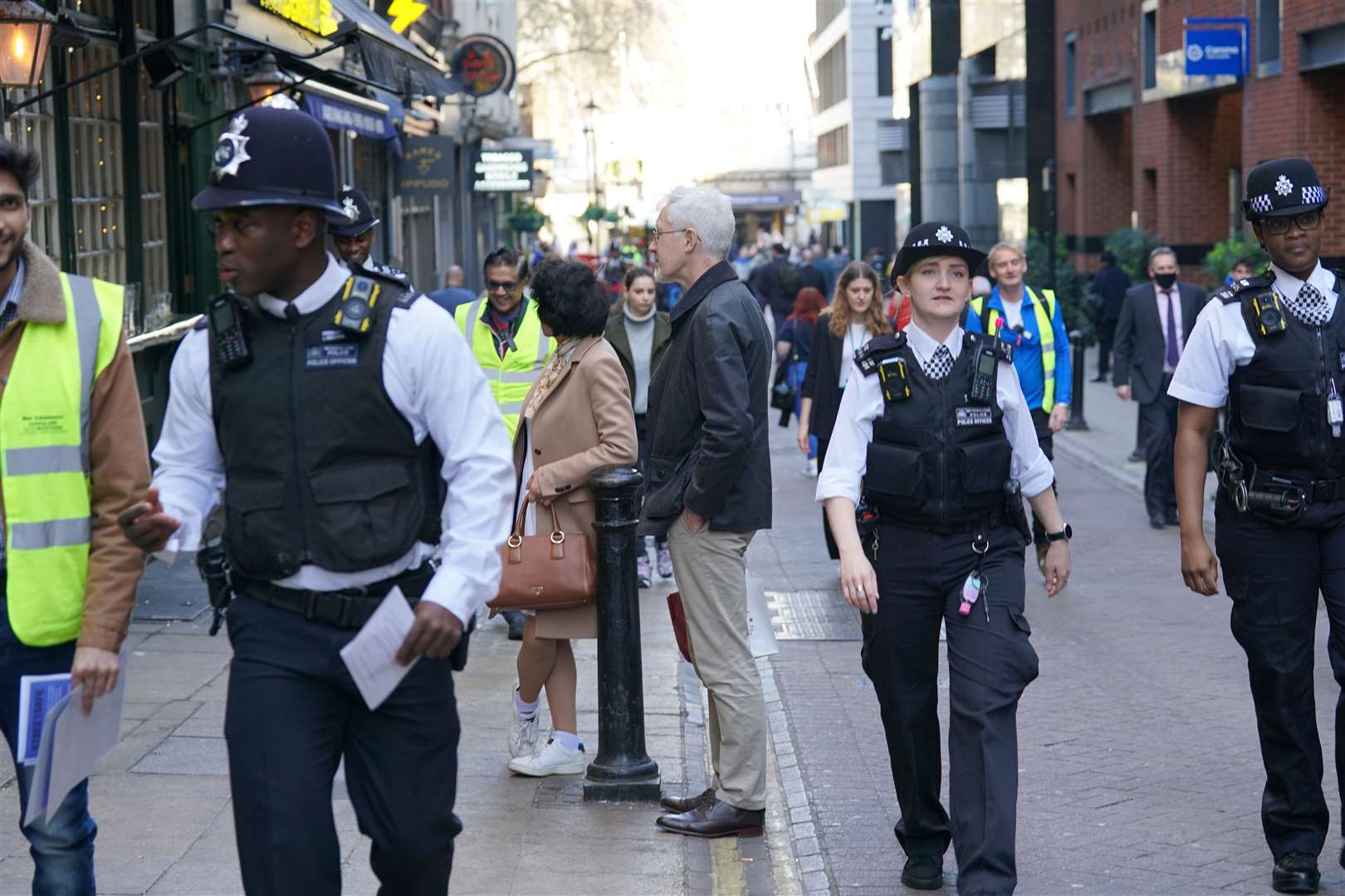 Police officers and volunteers speaking to the public about women’s safety as part of Operation Verona (Danielle Desouza/PA)