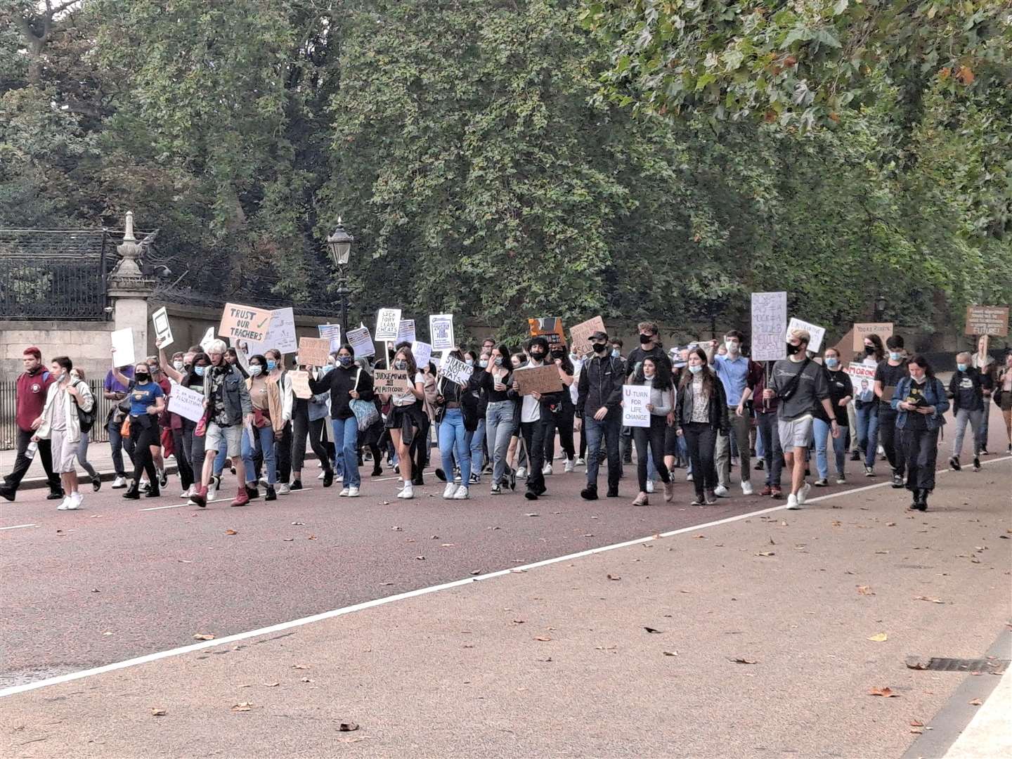Dozens of A-level pupils marched outside Buckingham Palace in today's protest over the results fiasco