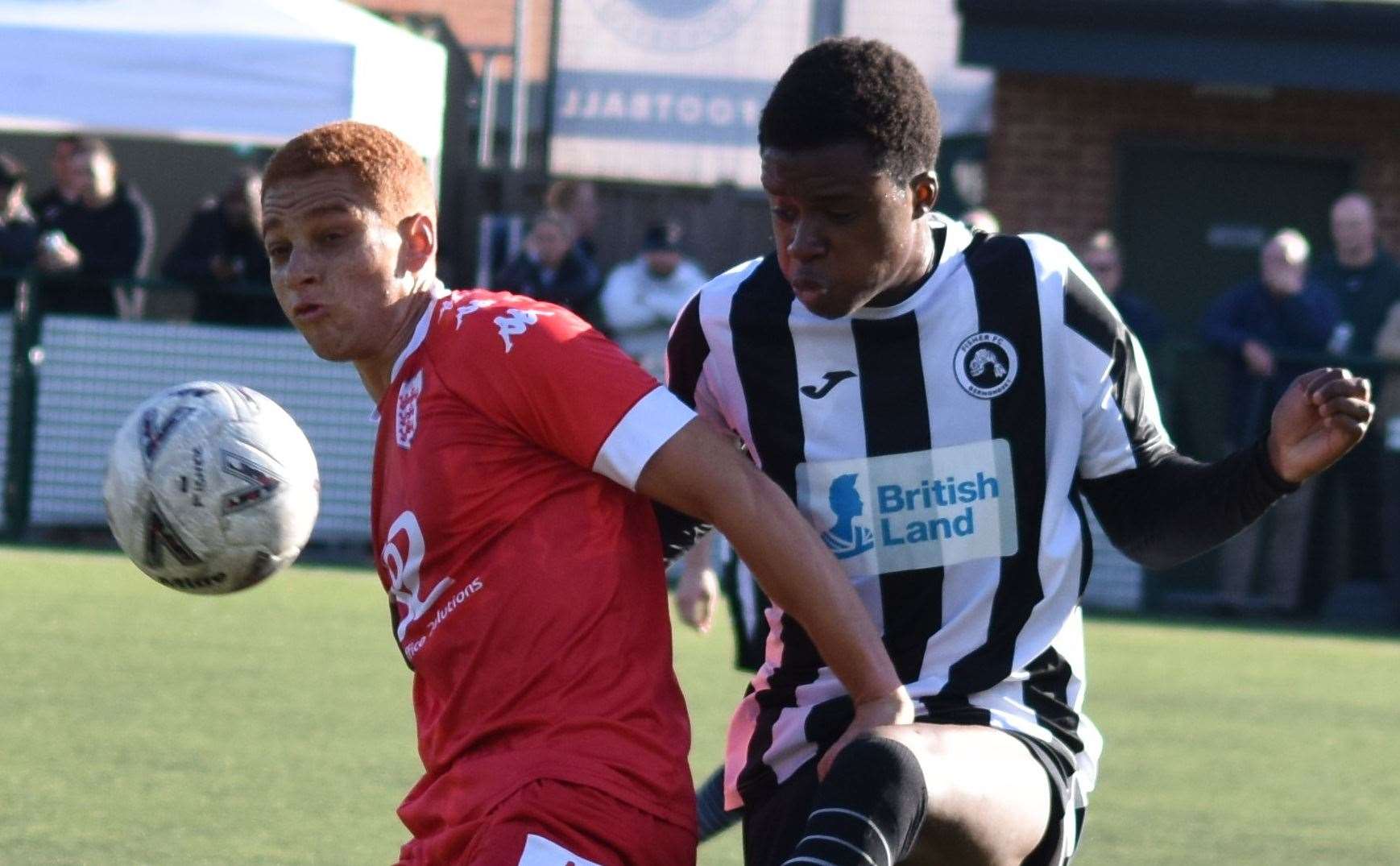 Tashi-Jay Kwayie shields the ball for Faversham against Fisher. Picture: Alan Coomes