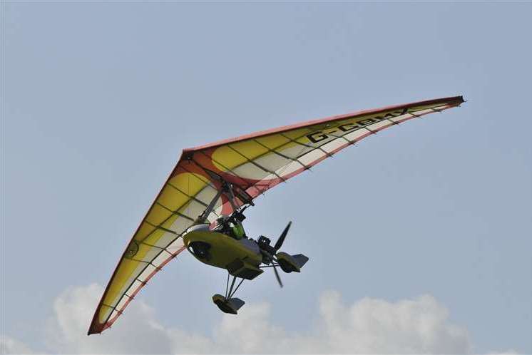 A member of the Kent Microlight Club flying over Sheppey. Stock picture