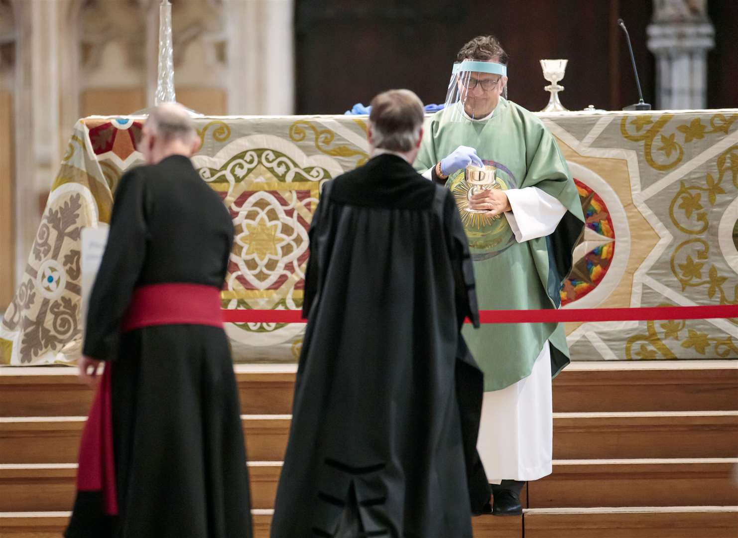 The Dean of York, the Right Revd Dr Jonathan Frost leads the first public Holy Communion to be held at York Minster since the easing of coronavirus lockdown restrictions across England (Danny Lawson/PA)