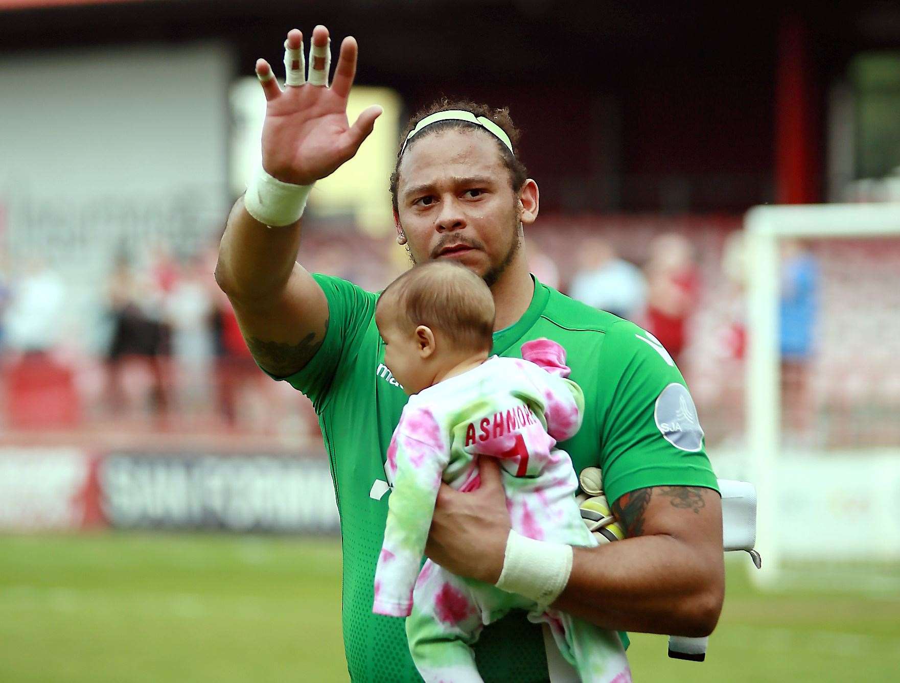 Ebbsfleet goalkeeper Nathan Ashmore with his daughter Naevia Monroe Picture: Phil Lee