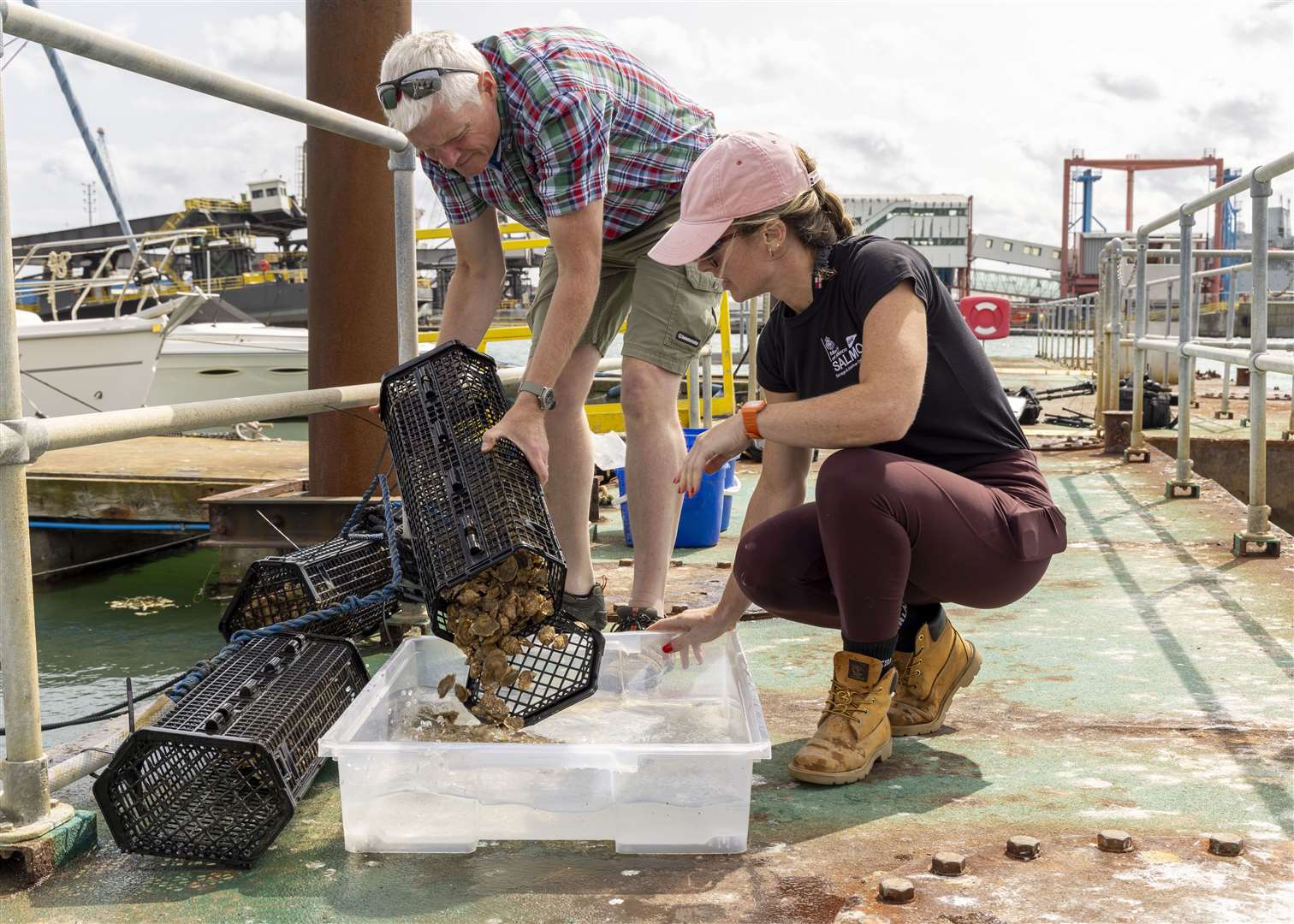 Harriet Rushton and Rod Jones inspect the oysters in Portsmouth (UK MOD Crown copyright/PA)