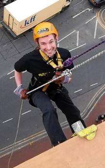 kmfm DJ Mike Russell takes part in the KM abseil