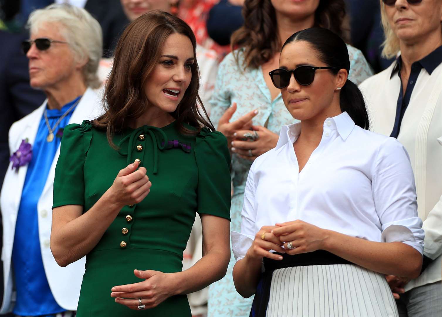 Meghan wearing white at Wimbledon with Kate (Mike Egerton/PA)