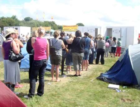 Revellers queue for the toilets in the VIP area. Picture: Sarah Marshall