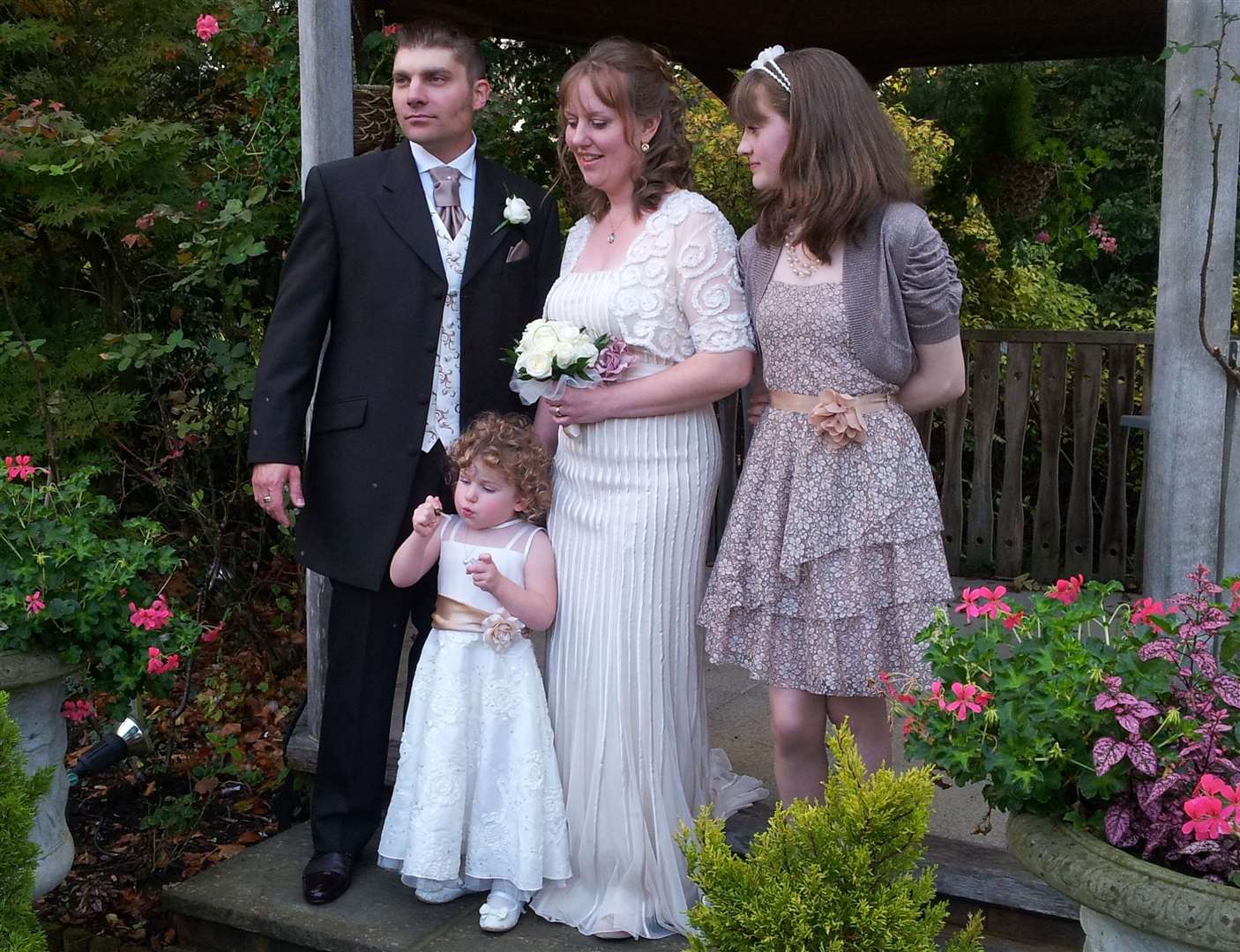 Mark Ellul on his wedding day with his wife Jackie, daughter Mia and stepdaughter Megan. Picture: Julia Hannaford