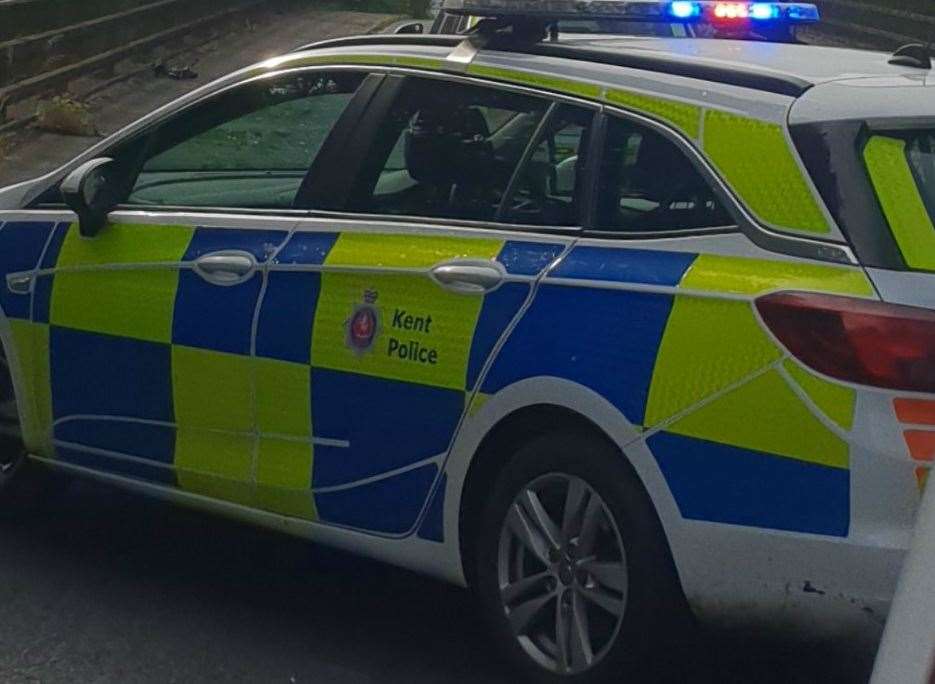 A man appears to be standing on a bridge over the M25