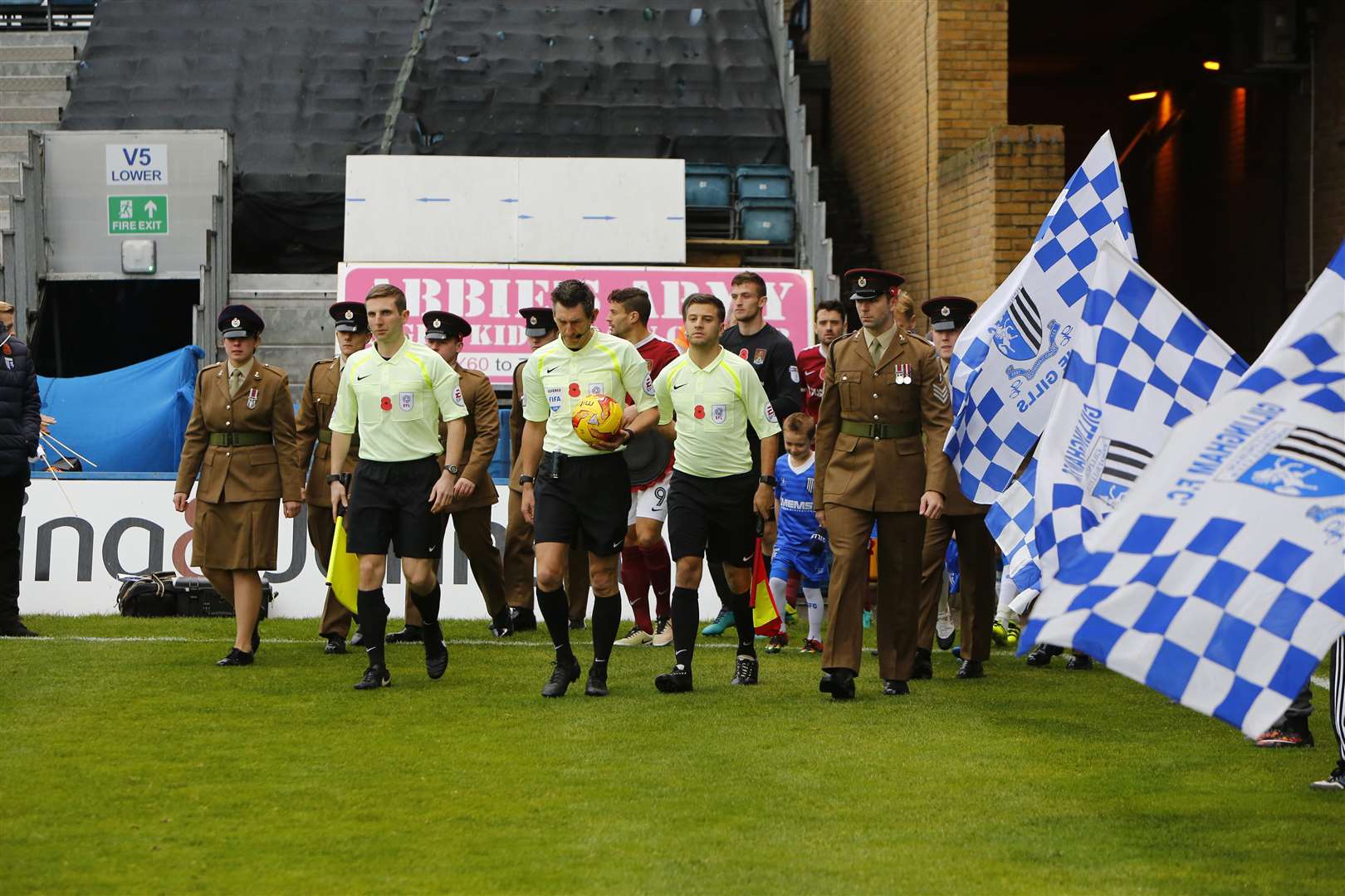 EReferee Lee Probert leads the Gills out at Priestfield against Northampton in November 2016, alongside the Royal Engineers. Picture: Andy Jones