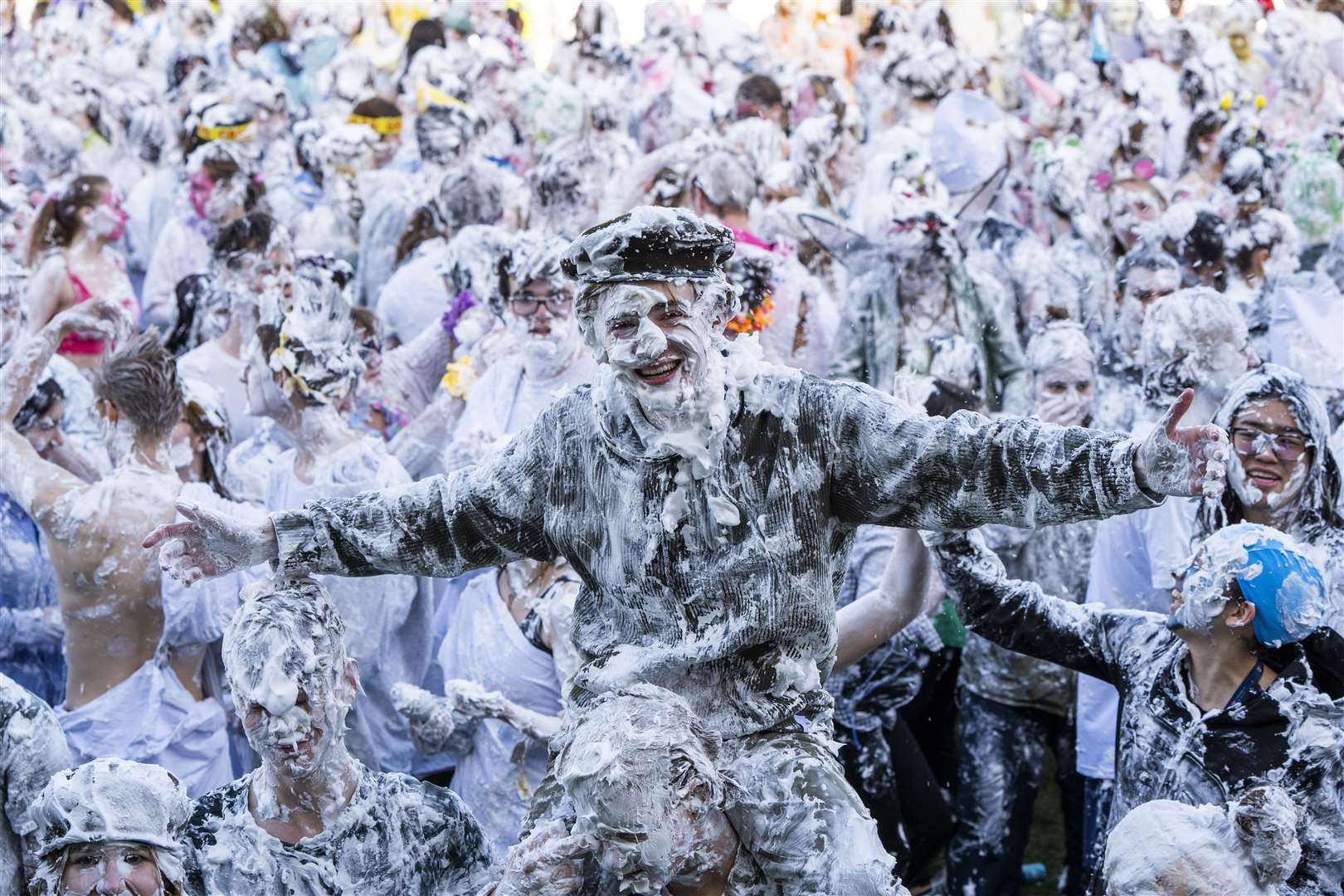 Students take part in the traditional Raisin Monday foam fight (Jane Barlow/PA)